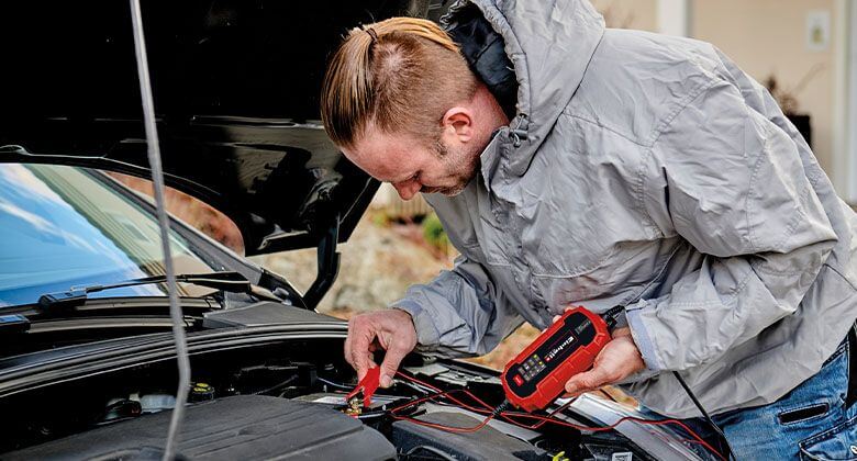 man using einhell battery charger